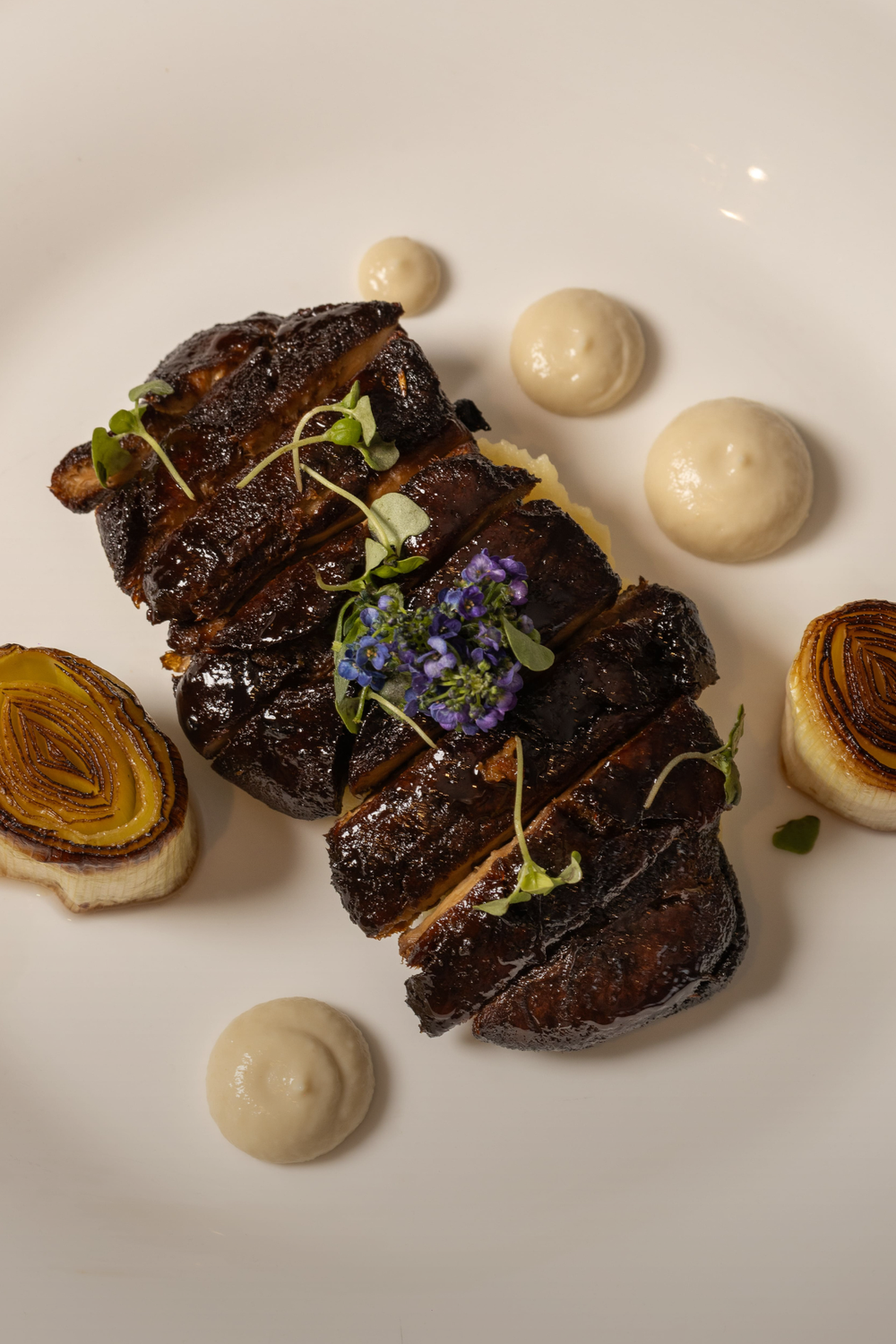 Glazed Lion Mushroom Steak, Charred Leeks, Truffled Mash Potatoes & Cauliflower Purée